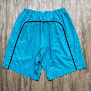 Lululemon. Men’s  Athletic shorts.Waist 26”.Inseam 9”.Blue Green. Drawstrings.